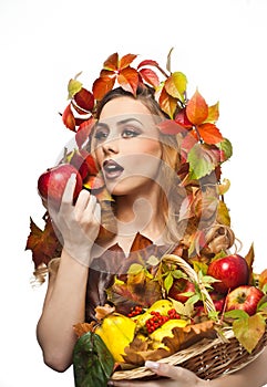 Autumnal woman. Beautiful creative makeup and hair style in fall concept studio shot. Beauty fashion model girl with fall makeup