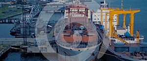 Auxiliary cargo ship in industrial port