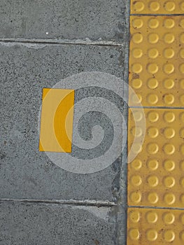 Auxiliary lines and yellow signs for people with disabilities photo