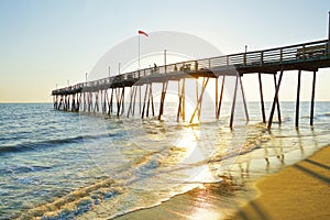 Avalon Pier and beach at the Outer Banks of North Carolina at sunrise