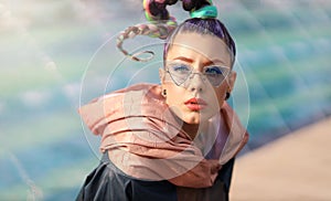 The avant-garde portrait girl with unusual make up and fancy sun glass. Avangarde fashion photo