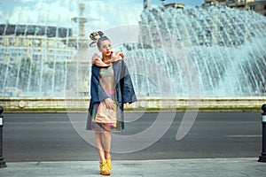 Avant garde style on street fashion model woman with funky outfit and crazy hair photo
