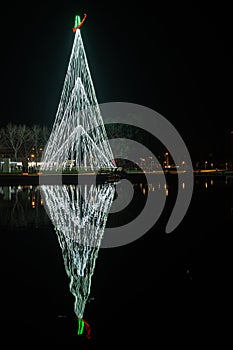 AVEIRO, PORTUGAL - CIRCA DECEMBER 2018: Fonte Nova`s garden with Christmas market and colored ferris wheel near Ria de Aveiro at