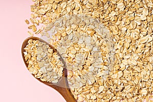Avena Sativa is scientific name of Oat cereal grain. Also known as Aveia or Avena. Healthy grains on a wooden spoon