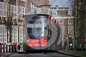 Avenio R-NET red black street car tram on line 15 on the Vijverberg in The Hague in The Netherlands