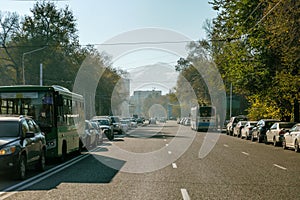 Avenue with cars in a beautiful mountain town. Resort in a modern metropolis