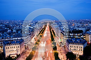 Avenue des Champs-Elysees in Paris, France at night