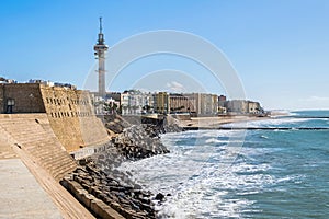 Avenue Fernandez Ladreda with Tavira II Tower and a beach Playa de Santa Maria del Mar in Cadiz, Spain photo