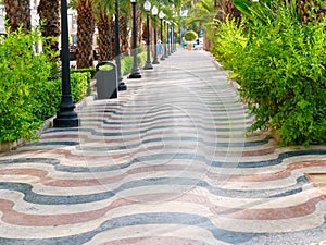 Avenue of palms in Alicante. Main promenade for tourists Explanada. Spain. photo