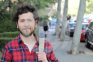 Average looking ethnically ambiguous young man outdoors