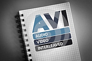 AVI - Audio Video Interleaved acronym on notepad, technology concept background photo