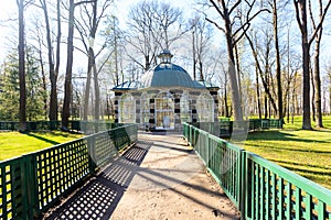 Aviary pavilion in The Lower Gardens in Peterhof in spring sunny day