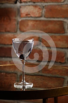 Aviation, drink with gin, lemon juice, maraschino liqueur and violet cream liqueur standing on bar counter.