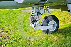 Aviation landing gear resting on grass