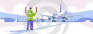 aviation marshaller supervisor near aircraft air traffic controller airline worker in signal vest professional airport