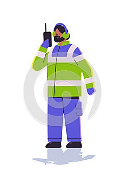 aviation marshaller in uniform using walkie talkie man air traffic controller airline worker in signal vest professional