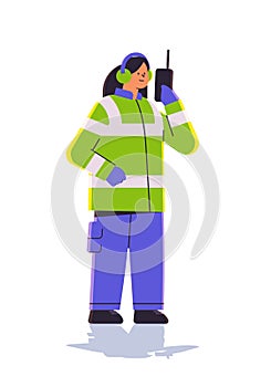 aviation marshaller using walkie talkie woman air traffic controller airline worker in signal vest professional airport photo