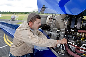 aviation mechanic working on aircraft
