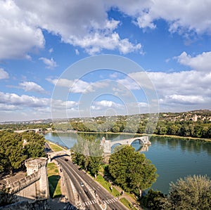 Avignon, famous bridge with Rhone river against blue sky in Provence, France