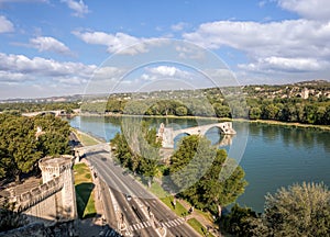 Avignon, famous bridge with Rhone river against blue sky in Provence, France