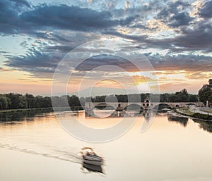 Avignon, famous bridge with Rhone river against sunset in Provence, France