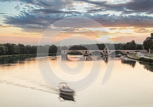 Avignon, famous bridge with Rhone river against sunset in Provence, France