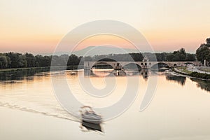 Avignon, famous bridge with Rhone river against sunset in Provence, France