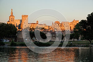 Avignon with Popes Palace during sunset in Provence, France photo