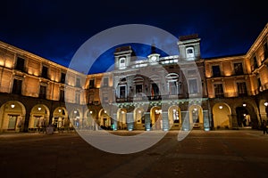 Avila Town Hall, Plaza del Mercado during sunset with a vibrant blue. photo