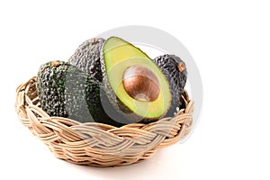 Avocado in backet isolated on white background, High in vitamins and minerals such as vitamin B