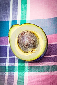 Avocado background with fresh organic avocado on old wooden table, top view