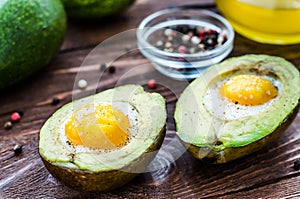 Avocado baked with egg, pepper and salt