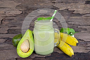 Avocado with banana green smoothies colorful fruit juice milkshake .