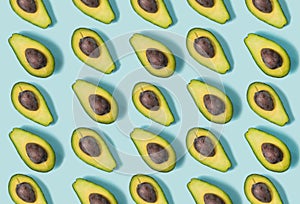 Avocado on the blue background. Top view