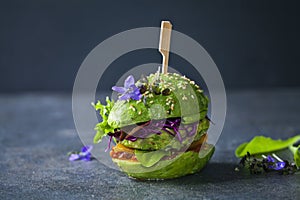 Avocado burger with green patty