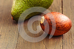 Avocado core on brown wooden old table