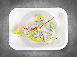 Avocado and cucumber tartare. Vegetarian food. Takeaway food. Top view, on a gray background
