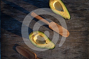 Avocado decorated on wood with wooden shovels