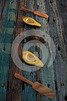 Avocado decorated on wood with wooden shovels