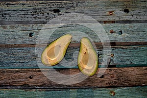 Avocado decorated on wood with wooden shovels