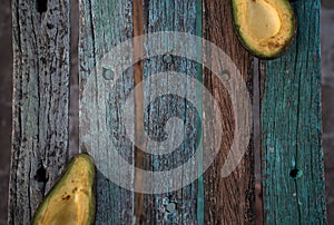 Avocado decorated on wood with wooden shovels