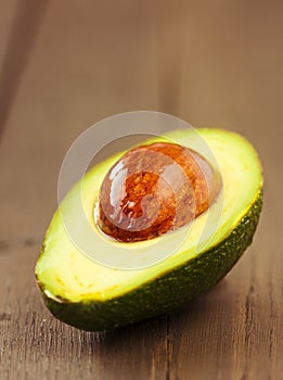 Avocado fruit on brown wooden old table