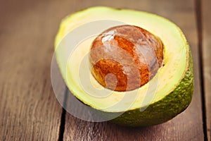 Avocado fruit on brown wooden old table