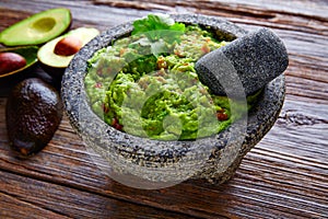 Avocado Guacamole on molcajete real Mexican photo