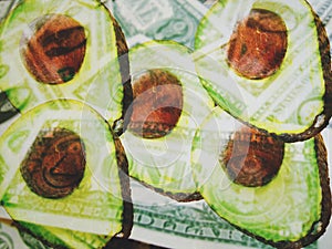 Avocado Halves Blended With Blurred American Dollars