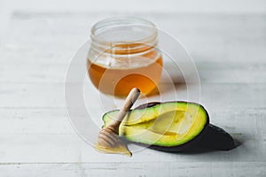 Avocado and honey On the white table