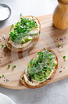 Avocado Hummus Toast with Sprouts, Healthy Snack, Breakfast, Vegetarian Meal