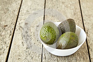 Avocado on old wooden background