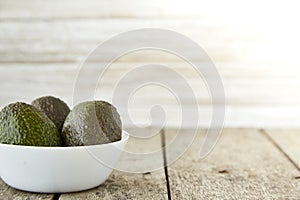 Avocado on old wooden background