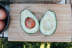 Avocado on old wooden table. Fruits healthy and Vegetarian food.